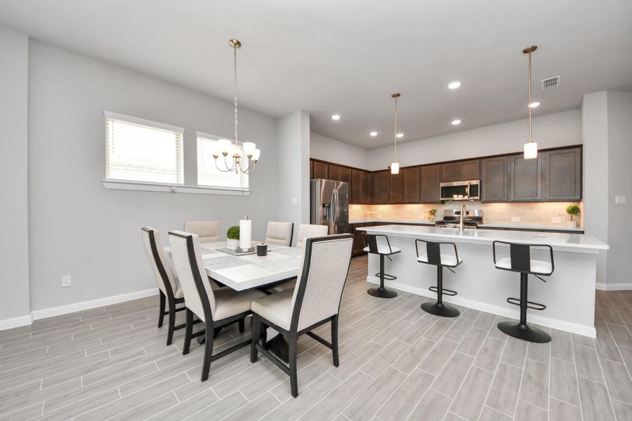 Dining area view toward kitchen that is ideal for home entertaining.