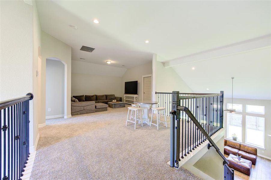 Expansive upstairs game room perfect for entertaining