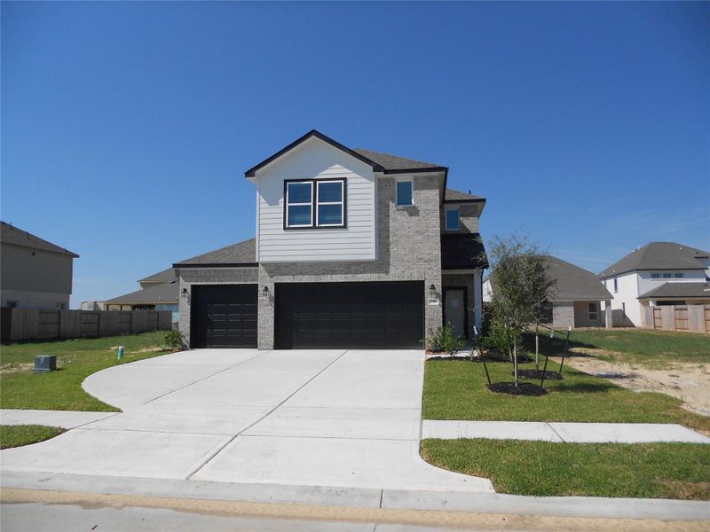 Front exterior of a new home in , Dayton, TX, highlighting curb appeal (Image 2). Front exterior of a new home in , Dayton, TX, highlighting curb appeal (Image 2).