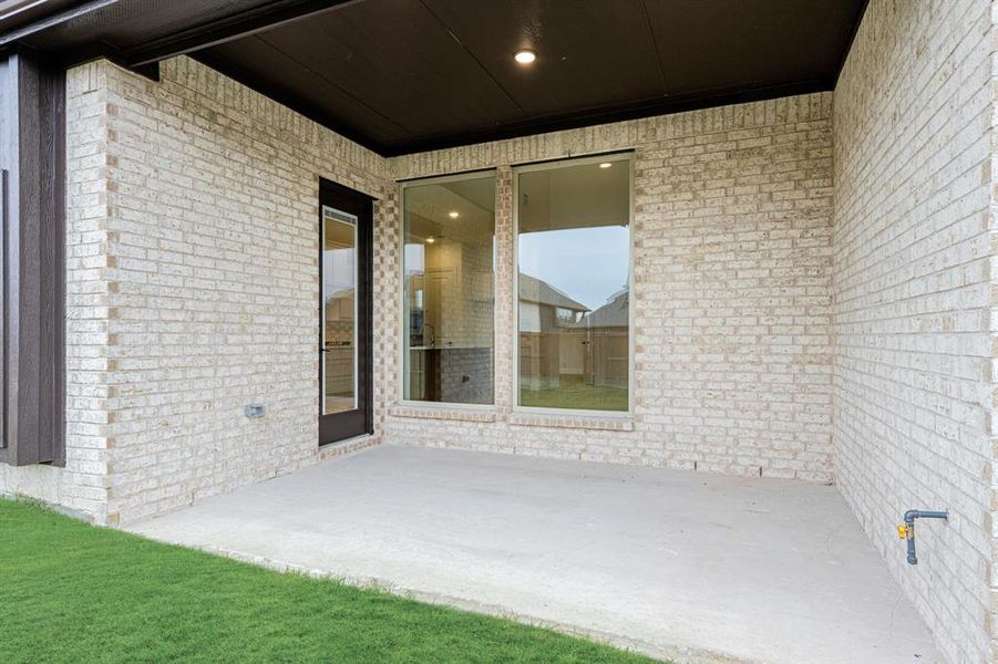 Exterior details and patio area of a home in Windsong Ranch Classic 61, Prosper (Image 3).