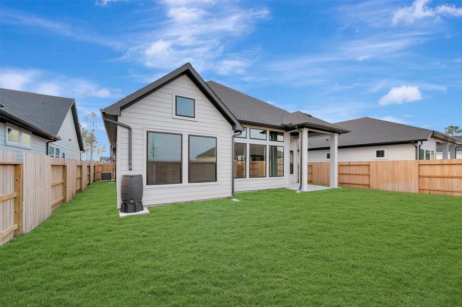 Exterior details and patio area of a home in ARTAVIA 50' Homesites, Conroe (Image 4).