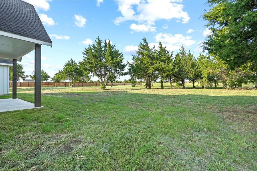 View of yard with a patio area View of yard with a patio area