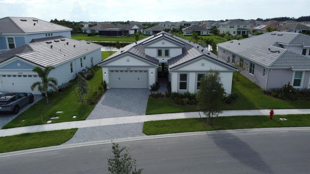 Front exterior of a new home in Westlake, Loxahatchee, FL, highlighting curb appeal (Image 27).