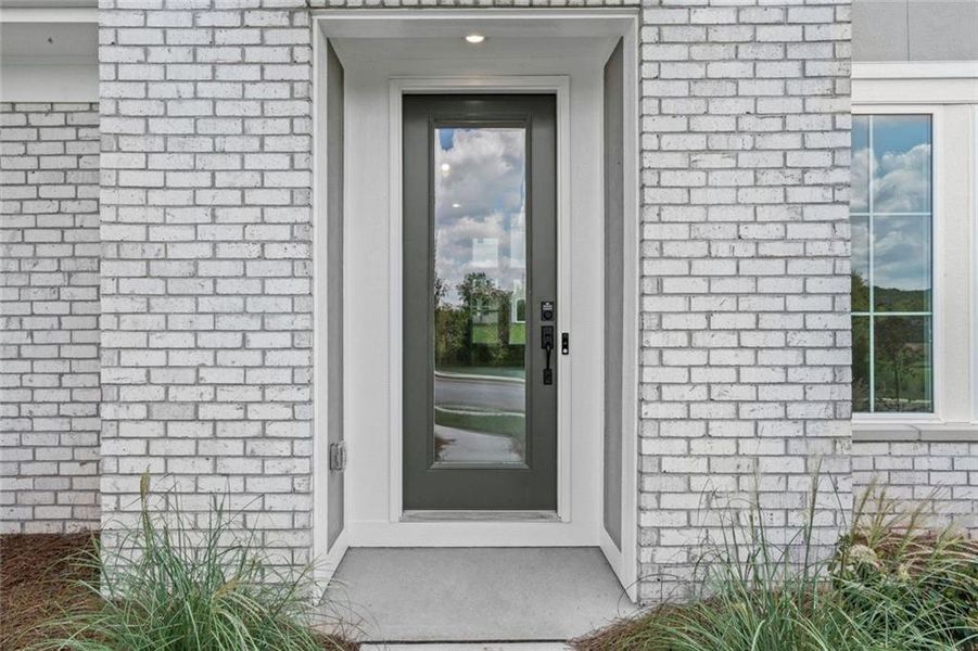 Exterior details and patio area of a home in Twin Lakes, Hoschton (Image 27).