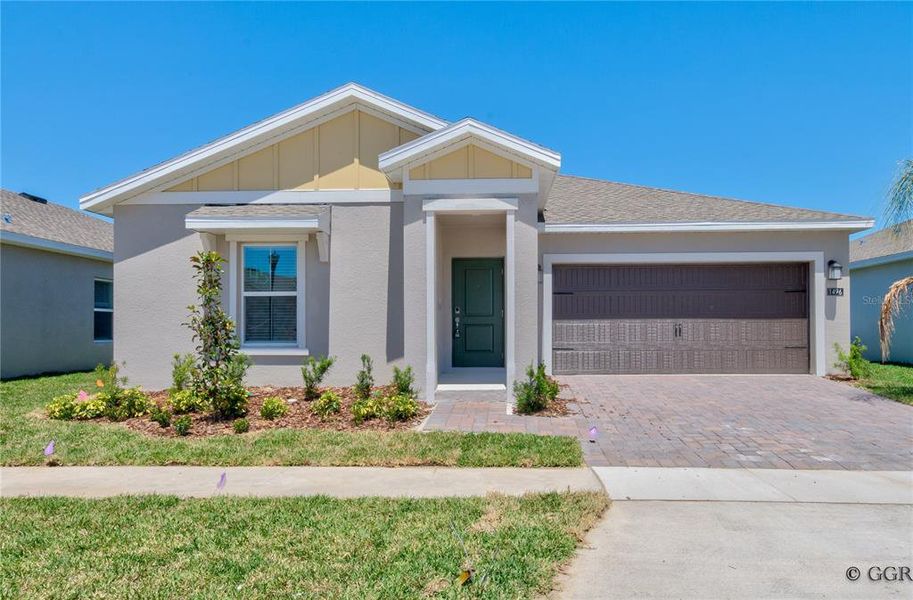 Front exterior of a new home in Knightsbridge, Kissimmee, FL, highlighting curb appeal (Image 1). Front exterior of a new home in Knightsbridge, Kissimmee, FL, highlighting curb appeal (Image 1).
