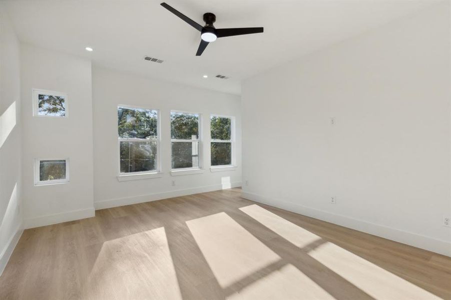 Unfurnished room featuring light hardwood / wood-style floors and ceiling fan