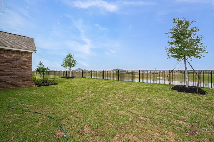 Representative exterior photo of a completed home built from the 2620 by Colina Homes in River Ranch, Dayton, TX (Image 32).