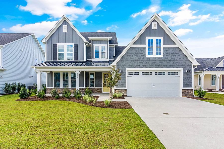 Representative exterior photo of a completed home built from the The Chandler by RobuckHomes in Windwater, Hampstead, NC (Image 21).