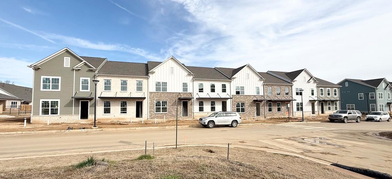 View of road featuring a residential view and curbs