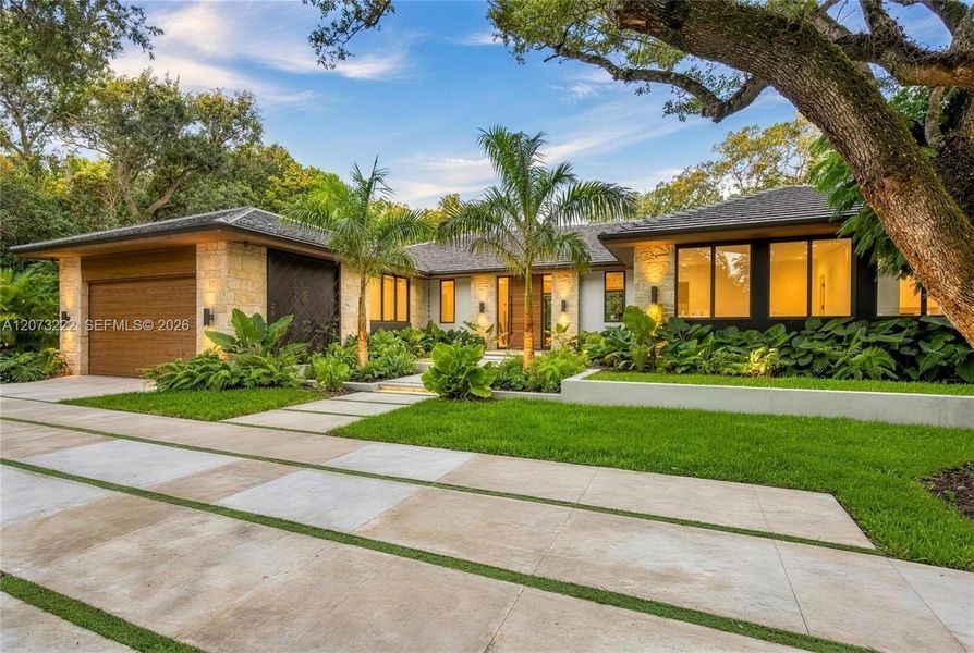 Front exterior of a new home in , Miami, FL, highlighting curb appeal (Image 1). Front exterior of a new home in , Miami, FL, highlighting curb appeal (Image 1).