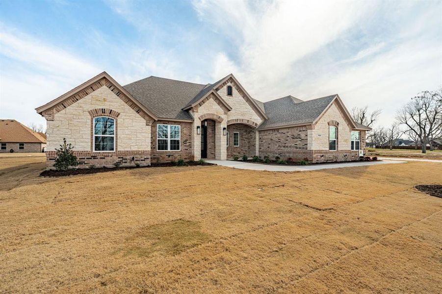 French country style house with a front lawn