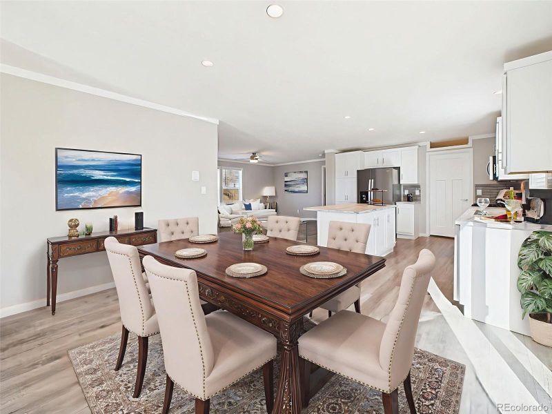 Virtually Staged Formal Dining Space – This digitally enhanced layout showcases a spacious dining zone off the front entry, ideal for hosting dinners or special gatherings.