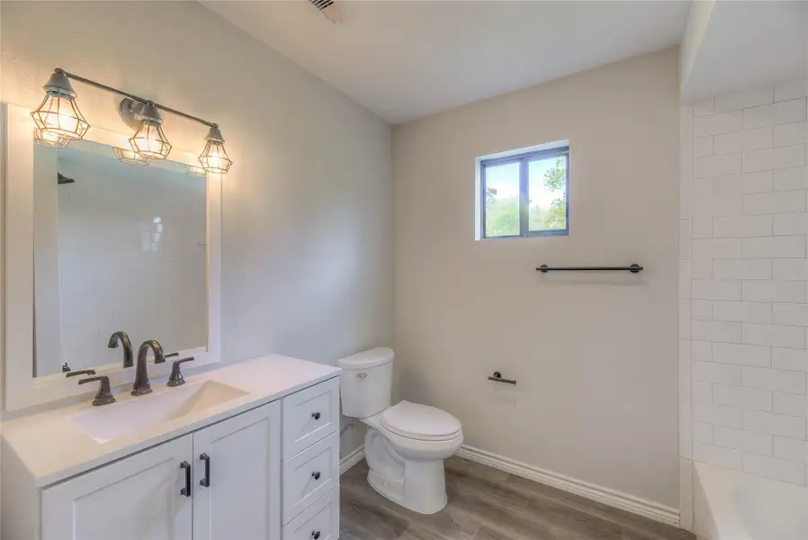 Guest bathroom , tile shower/tub Guest bathroom , tile shower/tub
