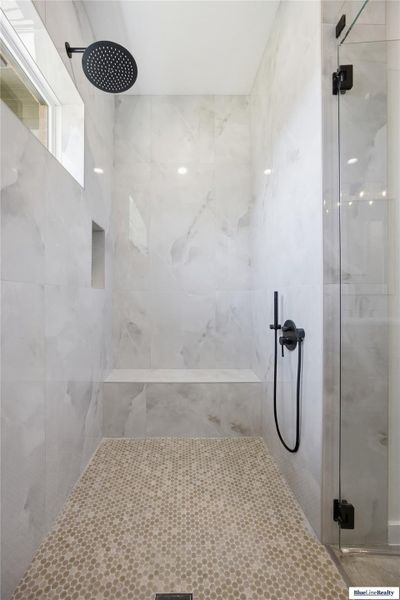 Full bathroom with a shower stall