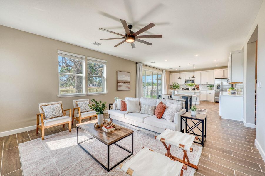 An open floorplan seamlessly connects the comfortable living area directly into the modern kitchen. An open floorplan seamlessly connects the comfortable living area directly into the modern kitchen.