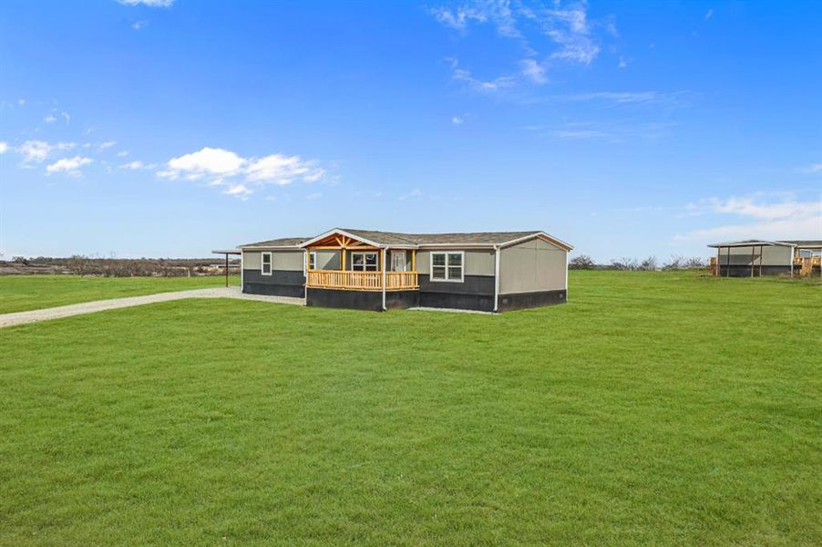 Exterior details and patio area of a home in , Poolville (Image 24).