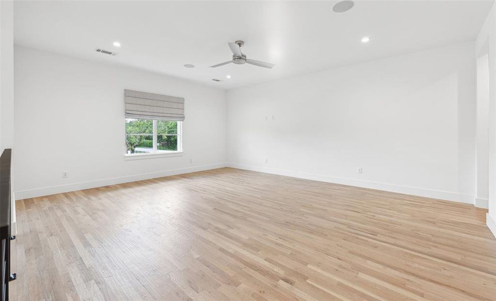 Spare room with ceiling fan and light hardwood / wood-style flooring