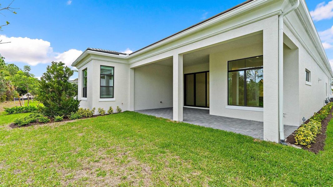 Front exterior of a new home in Artistry Palm Beach, Palm Beach Gardens, FL, highlighting curb appeal (Image 2).