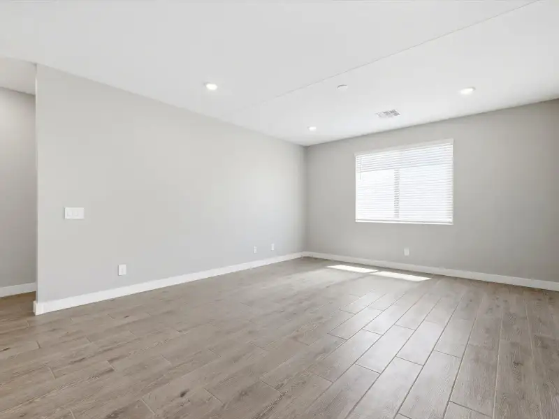 Spacious, unfurnished interior of a new home in Blossom Rock Reserve Series, Apache Junction (Image 13).