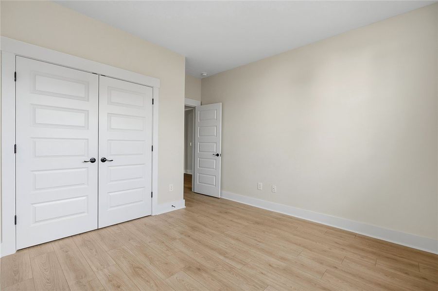Smooth wood floors and crisp white trim enhance th