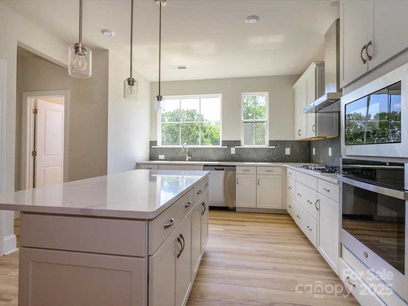 Crisp White Cabinetry and Brushed Nickle Hardware