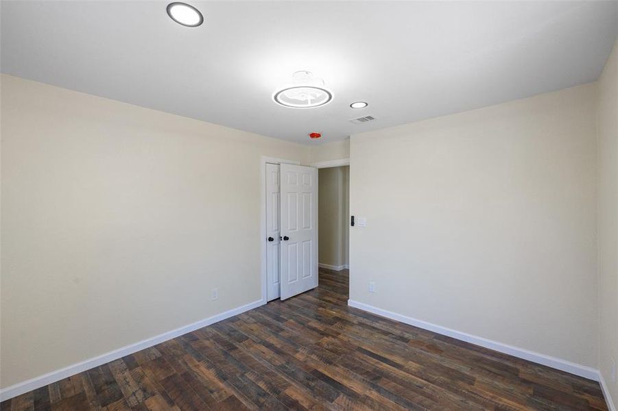 Empty room featuring hardwood / wood-style floors