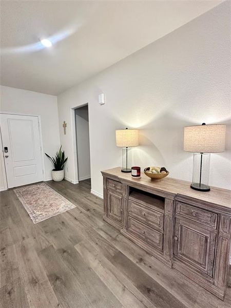 Hall with light wood finished floors and baseboards Hall with light wood finished floors and baseboards