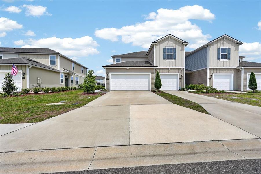 Front exterior of a new home in , Palm Coast, FL, highlighting curb appeal (Image 23).