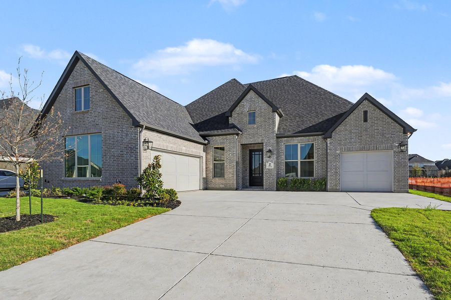 Front exterior of a new home in Quail Hollow, Rockwall, TX, highlighting curb appeal (Image 2). Front exterior of a new home in Quail Hollow, Rockwall, TX, highlighting curb appeal (Image 2).