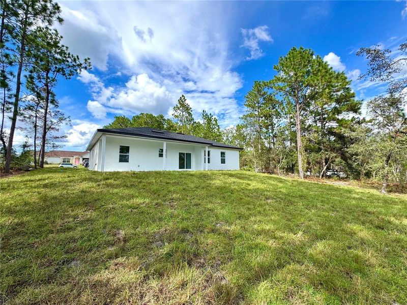 Front exterior of a new home in , Citrus Springs, FL, highlighting curb appeal (Image 18).