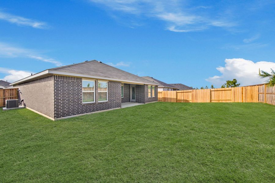 Exterior details and patio area of a home in The Canopies, Splendora (Image 4).