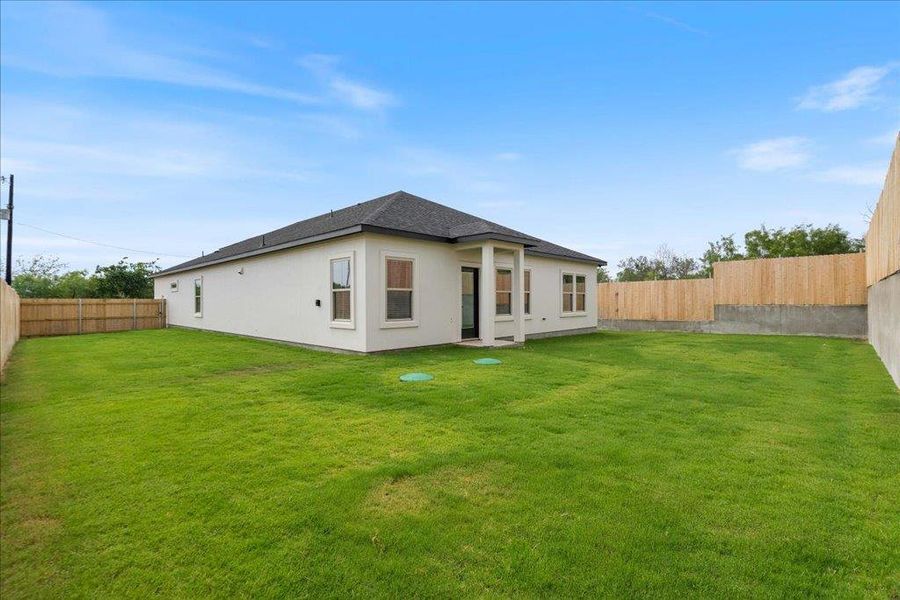Views of the large, fully-fenced backyard that provides an abundance of outdoor space. Views of the large, fully-fenced backyard that provides an abundance of outdoor space.