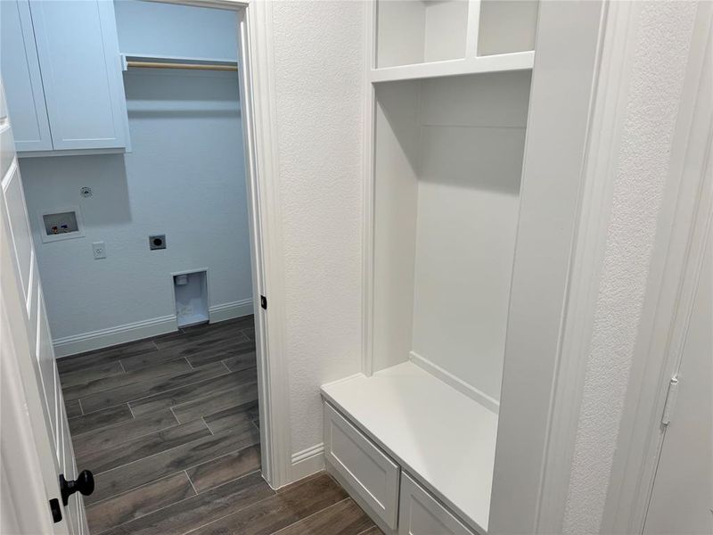Mudroom with dark hardwood / wood-style flooring