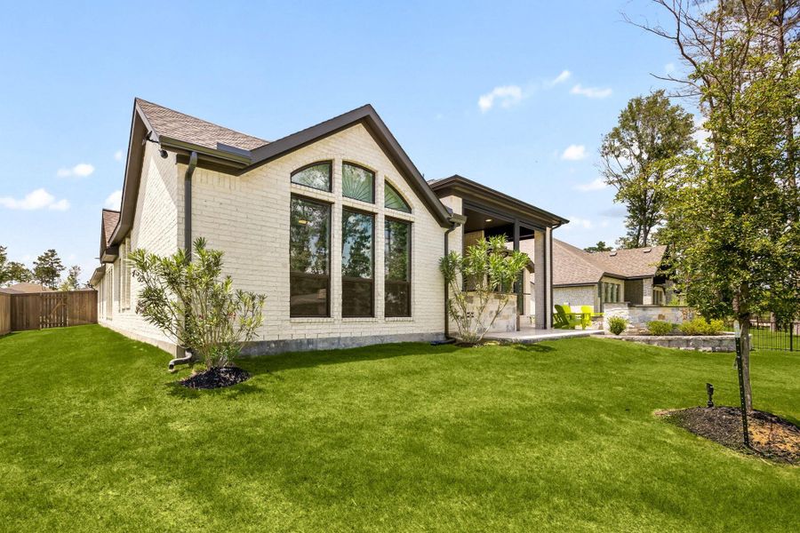 Exterior details and patio area of a home in The Highlands, Porter (Image 32).
