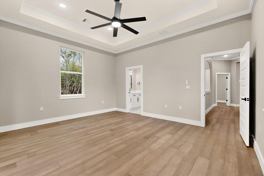Second Jack and Jill Bedroom featuring crown molding, wood floors, a ceiling fan, and recessed lighting Second Jack and Jill Bedroom featuring crown molding, wood floors, a ceiling fan, and recessed lighting