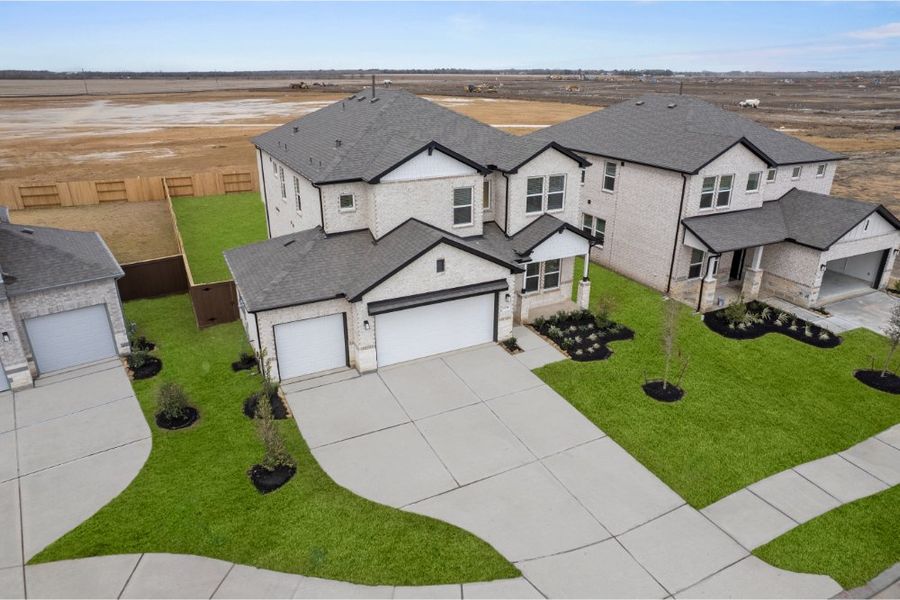 Front exterior of a new home in Creekhaven, Rosharon, TX, highlighting curb appeal (Image 18).