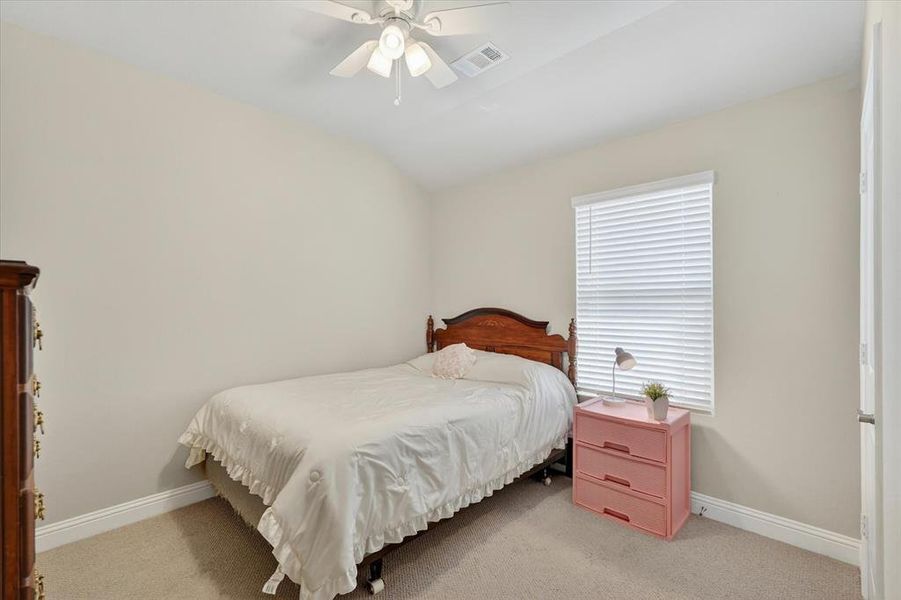 Carpeted interior room featuring light neutral wall tones and white baseboards Carpeted interior room featuring light neutral wall tones and white baseboards
