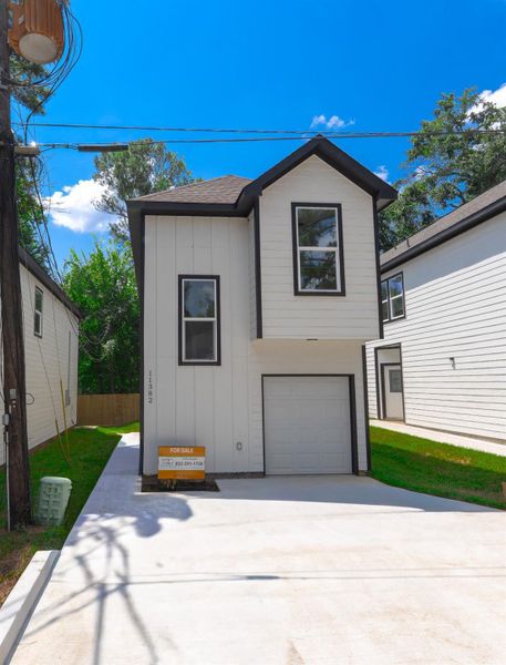 Front exterior of a new home in , Willis, TX, highlighting curb appeal (Image 23).