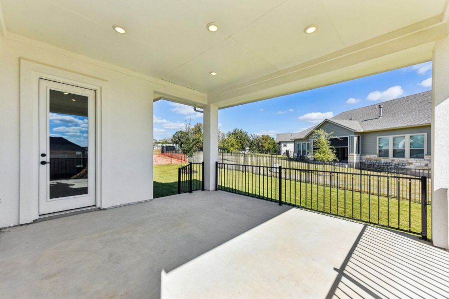 Fenced backyard with a patio and a residential view