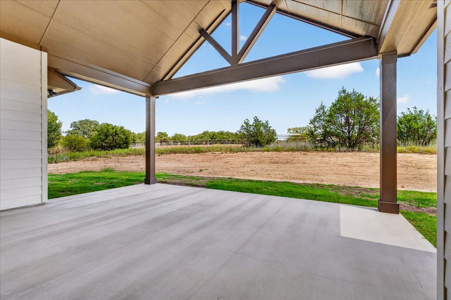 Exterior details and patio area of a home in Monarch Manor, Poolville (Image 3).