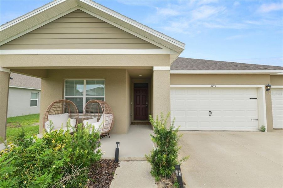 Front exterior of a new home in Wind Meadows South, Bartow, FL, highlighting curb appeal (Image 31). Front exterior of a new home in Wind Meadows South, Bartow, FL, highlighting curb appeal (Image 31).