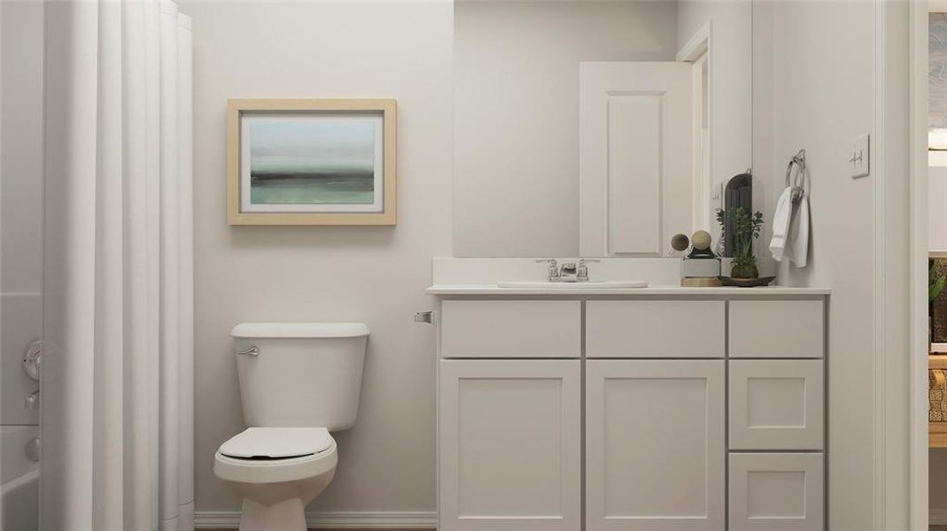 Bathroom featuring vanity and toilet