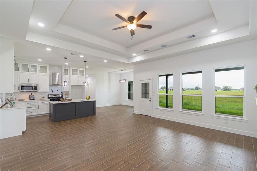 Open concept with living, dining and breakfast area combined.  Large windows with natural lighting.