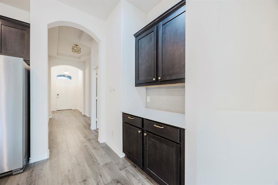 Corridor with light hardwood / wood-style floors