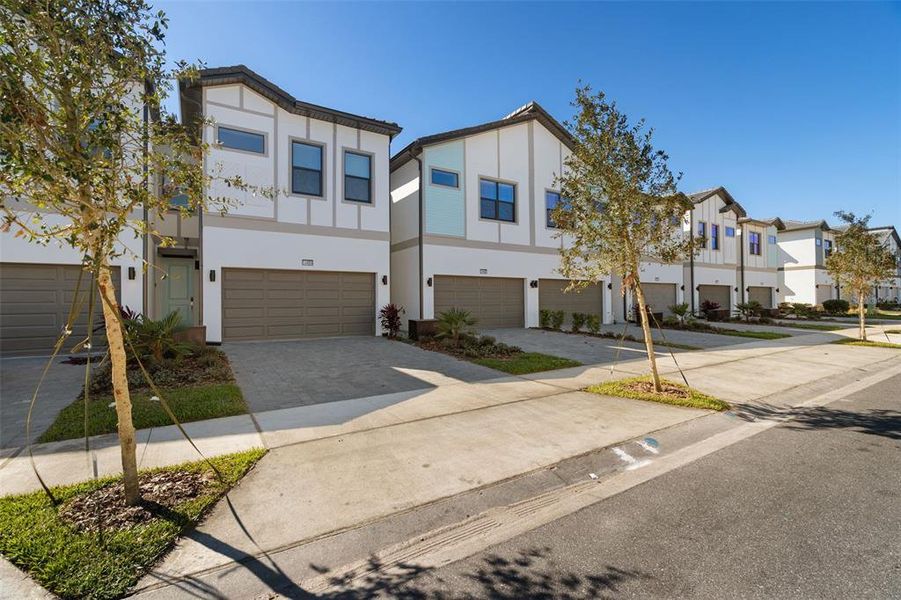 Front exterior of a new home in , Orlando, FL, highlighting curb appeal (Image 21).
