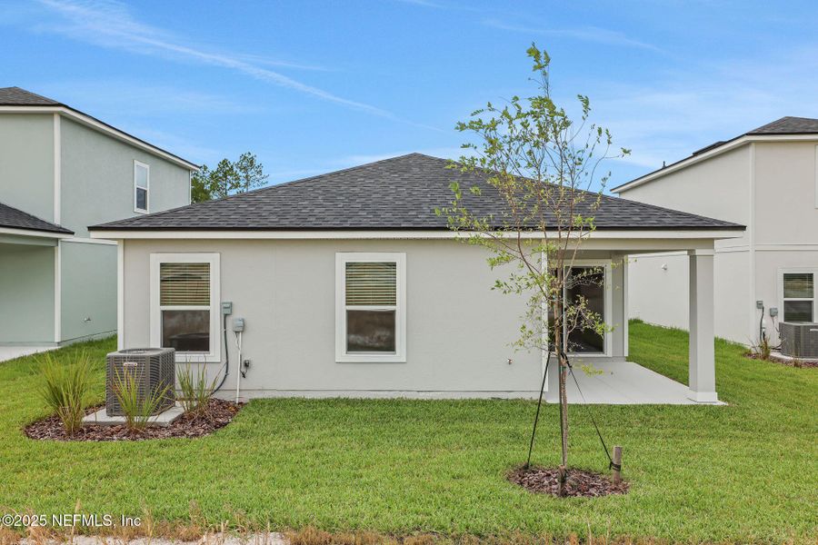 Front exterior of a new home in Bellbrooke, Jacksonville, FL, highlighting curb appeal (Image 12).