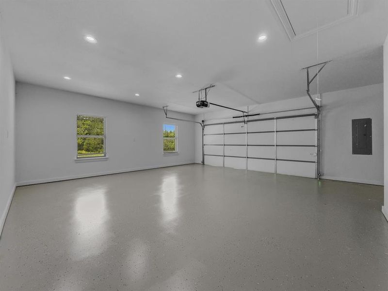 Garage featuring recessed lighting and electric panel Garage featuring recessed lighting and electric panel