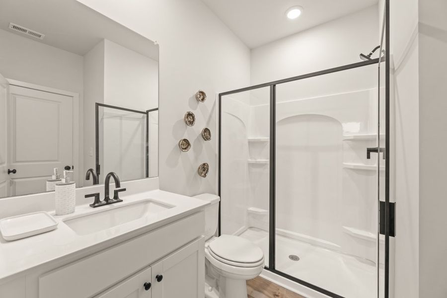 A bathroom with a glass shower.