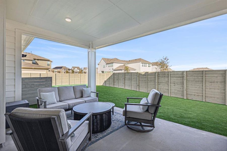 View of patio, featuring an outdoor living space, artificial pet friendly turf