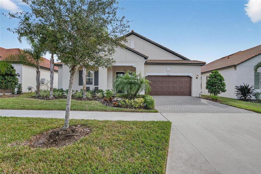 Front exterior of a new home in Southshore Bay: The Estates, Wimauma, FL, highlighting curb appeal (Image 24).